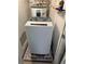 Efficient laundry room space with washing machine and water heater at 9440 E Girard Ave # 1, Denver, CO 80231