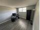 Functional office space featuring a large desk, shelving, ample natural light, and wood-look flooring at 9440 E Girard Ave # 1, Denver, CO 80231