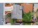 Bird's eye view of a house featuring a well-maintained roof, green yard, mulch landscaping, and a wooden deck at 712 S Longmont Ave, Lafayette, CO 80026