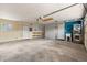 Spacious garage with washer, dryer, sink, storage, and shelving at 712 S Longmont Ave, Lafayette, CO 80026