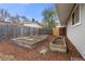 Backyard features multiple raised garden beds, mulch, and a wood fence at 712 S Longmont Ave, Lafayette, CO 80026