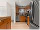 Efficient kitchen with wood cabinets, modern stainless steel appliances, and a convenient design at 712 S Longmont Ave, Lafayette, CO 80026