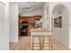 Well-appointed kitchen featuring wood cabinets, a breakfast bar, and modern appliances, perfect for culinary enthusiasts at 712 S Longmont Ave, Lafayette, CO 80026
