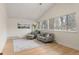 Bright living room featuring wood floors, comfortable seating, large windows, and a tranquil atmosphere at 712 S Longmont Ave, Lafayette, CO 80026