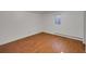 Unfurnished basement with wood floor and a window, ready for customization to fit any need at 2694 S Krameria St, Denver, CO 80222