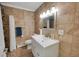 Bathroom featuring tiled walk-in shower, updated vanity and modern fixtures at 2694 S Krameria St, Denver, CO 80222