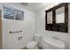 Bathroom featuring safety bar, medicine cabinet with storage, and a sink at 2694 S Krameria St, Denver, CO 80222
