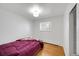 Bedroom featuring hardwood floors, and a large window at 2694 S Krameria St, Denver, CO 80222