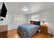 Bright bedroom featuring hardwood floors, and two windows at 2694 S Krameria St, Denver, CO 80222