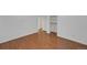 Bright bedroom featuring wood floors, closet and a neutral color palette at 2694 S Krameria St, Denver, CO 80222
