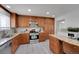 Spacious kitchen featuring granite counters, stainless appliances, and ample storage at 2694 S Krameria St, Denver, CO 80222