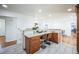 Stylish kitchen with granite countertops, stainless appliances, and breakfast bar seating at 2694 S Krameria St, Denver, CO 80222