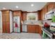 Modern kitchen with stainless steel appliances, granite countertops, and ample cabinet space at 2694 S Krameria St, Denver, CO 80222