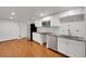 Spacious kitchen with white cabinets, stainless steel appliances, and granite countertops at 2694 S Krameria St, Denver, CO 80222