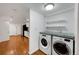 Well-equipped laundry area with modern appliances and granite countertop at 2694 S Krameria St, Denver, CO 80222