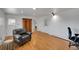 Bright living room boasts hardwood floors, neutral walls, and lots of natural light at 2694 S Krameria St, Denver, CO 80222