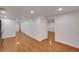 Inviting living room features wood floors with multiple entryways at 2694 S Krameria St, Denver, CO 80222
