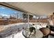 Cozy covered patio with outdoor seating overlooking the backyard at 2694 S Krameria St, Denver, CO 80222