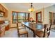 Dining area featuring natural light, a large table and a window with wooded views at 6154 Belmont Way, Parker, CO 80134