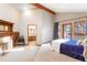 Bright main bedroom featuring a fireplace, outdoor access, and an en-suite bathroom view at 6154 Belmont Way, Parker, CO 80134