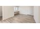 Bedroom features stylish wood look floors, built-in desk, and natural light from a window at 10196 Worchester St, Commerce City, CO 80022