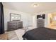 Bright bedroom with gray furniture set, soft carpet, and a large window for natural light at 10196 Worchester St, Commerce City, CO 80022