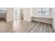 Bright and airy bedroom space with wood look floors, a built-in desk, and closet space at 10196 Worchester St, Commerce City, CO 80022