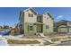 Inviting two-story home with a green and beige facade, set in a residential neighborhood at 10196 Worchester St, Commerce City, CO 80022