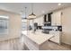 Modern kitchen with a large island, stainless steel appliances, and sleek cabinetry at 10196 Worchester St, Commerce City, CO 80022