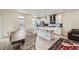 Open kitchen and dining area featuring a center island and access to the living room at 10196 Worchester St, Commerce City, CO 80022