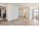 Spacious open living space with modern wood look flooring and neutral paint at 10196 Worchester St, Commerce City, CO 80022