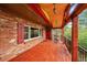 Relaxing deck featuring beautiful wood ceiling, exposed beams, and gorgeous railing design at 29832 Dorothy Rd, Evergreen, CO 80439