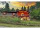 Charming home featuring a spacious deck, beautiful sunset views, and lush surrounding greenery at 29832 Dorothy Rd, Evergreen, CO 80439