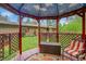Cozy gazebo on a spacious green lot with seating and lattice design provides a relaxing outdoor space at 29832 Dorothy Rd, Evergreen, CO 80439