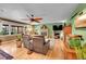 Comfortable living room featuring a fireplace, views of deck and hardwood flooring at 29832 Dorothy Rd, Evergreen, CO 80439