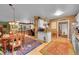Open concept living space featuring a dining area, kitchen, and cozy living room with fireplace at 29832 Dorothy Rd, Evergreen, CO 80439