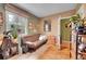 Inviting office space with a comfortable couch, large window, and stylish decor at 29832 Dorothy Rd, Evergreen, CO 80439