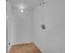 A minimalist shower space with white walls and basic fixtures at 29832 Dorothy Rd, Evergreen, CO 80439