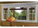 Bright window offering a view of the forest and unique railing design at 29832 Dorothy Rd, Evergreen, CO 80439