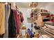 Walk-in closet with storage shelving, hanging clothes, and space for organization at 29832 Dorothy Rd, Evergreen, CO 80439