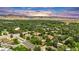 Beautiful aerial view of home in lush neighborhood with mountain views, showing landscaping and surroundings at 3807 Paseo Del Prado, Boulder, CO 80301