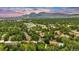Stunning aerial view of property showcasing lush landscaping, mountain views, and community amenities at 3807 Paseo Del Prado, Boulder, CO 80301