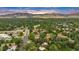 Great aerial view of the property in a lush neighborhood with mature trees and amazing mountain views at 3807 Paseo Del Prado, Boulder, CO 80301