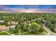 Wonderful aerial view of community surrounded by lush trees and beautiful landscape with mountain backdrop at 3807 Paseo Del Prado, Boulder, CO 80301