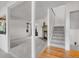 Spacious living room with hardwood floors, stone fireplace, and natural light at 3807 Paseo Del Prado, Boulder, CO 80301