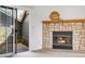 The living room features a stone fireplace and sliding glass doors leading to an outdoor space at 3807 Paseo Del Prado, Boulder, CO 80301