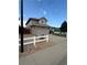 Two-story home with stone accents, a two-car garage, and a well-maintained front yard at 2551 W 58Th W Ave, Denver, CO 80221