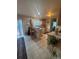 Bright kitchen featuring tile floors, a breakfast bar, and ample cabinet space at 2551 W 58Th W Ave, Denver, CO 80221