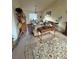 Bright living room with comfortable furniture, vaulted ceilings, and a decorative horse statue at 2551 W 58Th W Ave, Denver, CO 80221