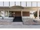 Inviting building entrance with brick facade, covered walkway, and professionally landscaped surroundings at 1090 N Lafayette St # 503, Denver, CO 80218